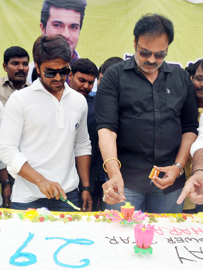 Ram Charan Teja cuts his birthday cake with father Chiranjeevi