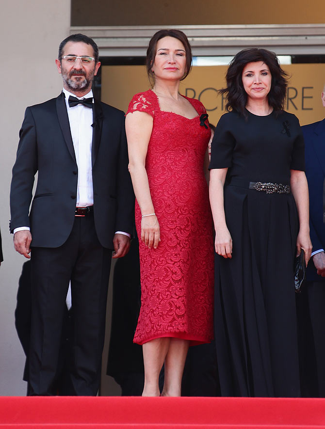 Actress Demet Akbag (center) poses with director Nuri Bilge Ceylan and his wife and the film's co-writer Ebru Ceylan attend the Winter Sleep photocall