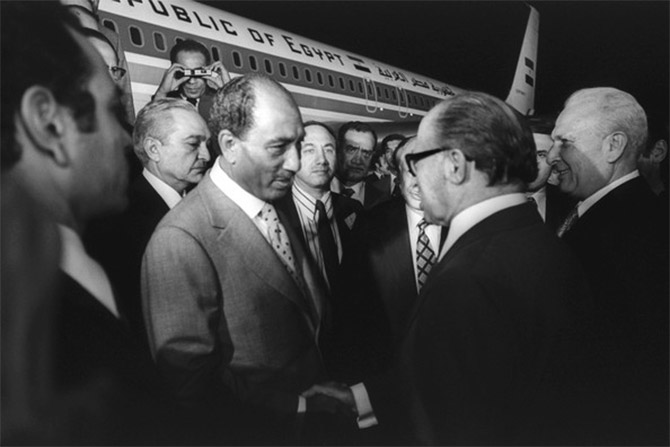 Egyptian President Anwar Sadat is greeted by Israeli Prime Minister Menachem Begin, Jerusalem, November 19. 1977.