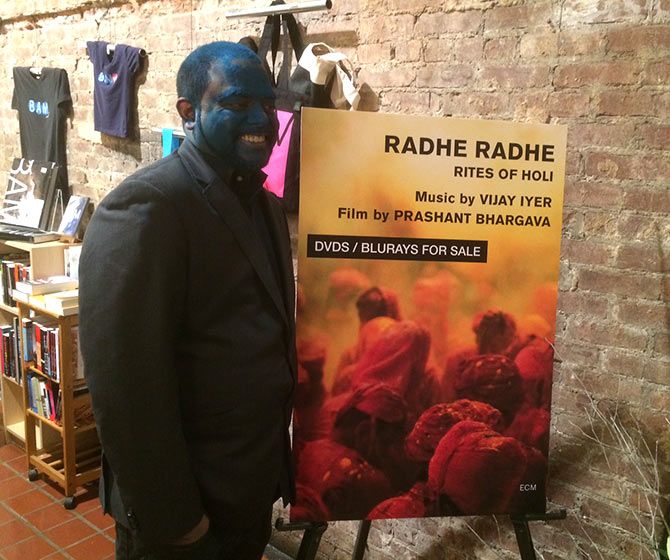 Prashant Bhargava, with the poster of his film Radhe Radhe