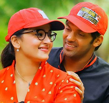 Arya and Anushka Shetty in Inji Iduppazhagi 