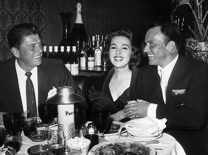 Ronald Reagan, Barbara Rush and Frank Sinatra celebrate the premiere of the latter's film, A Hole In The Head
