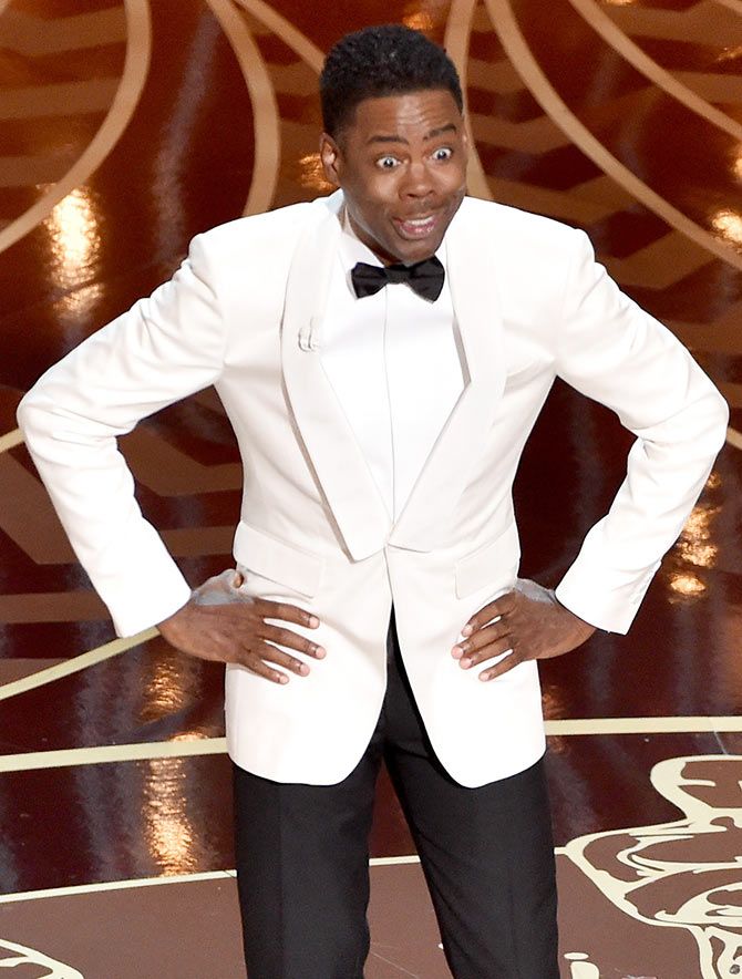Chris Rock delivers his opening monologue at the Oscars. Photograph: Kevin Winters/Getty Images