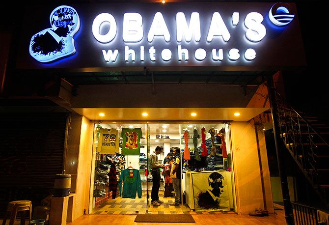 Customers shop inside an apparel store named "Obama's white house" in the western Indian city of Ahmedabad December 3, 2013. Photo: Amit Dave/Reuters