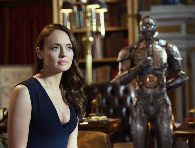 Laura Haddock as Viven Wembley and Cogman in the background