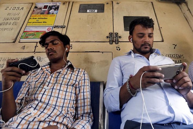 Youngsters using mobile phones to watch content