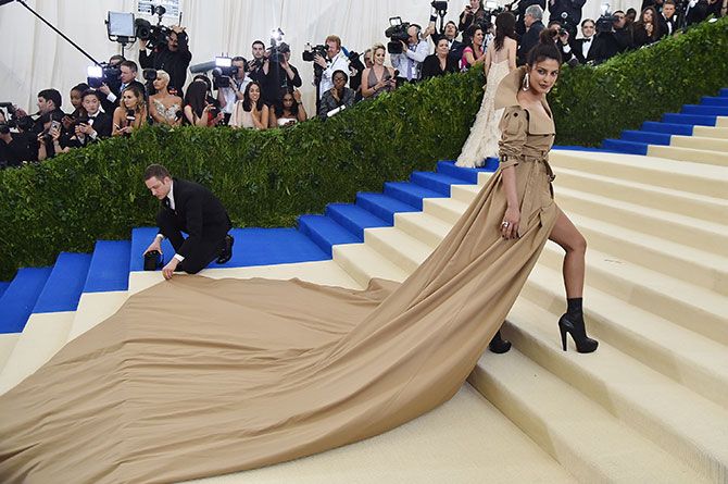 Priyanka's famous double breasted trenchcoat with a dramatic train at the Met Gala last year