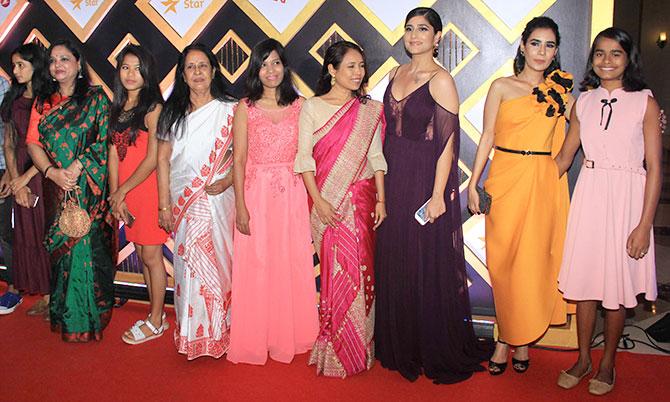 Rima Das with the cast of her film, Village Rockstars