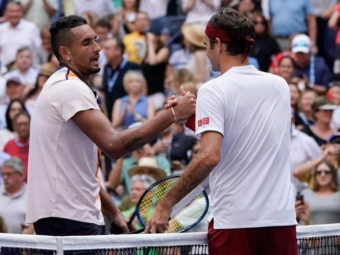 Nick Kyrgios congratulates Roger Federer after the match