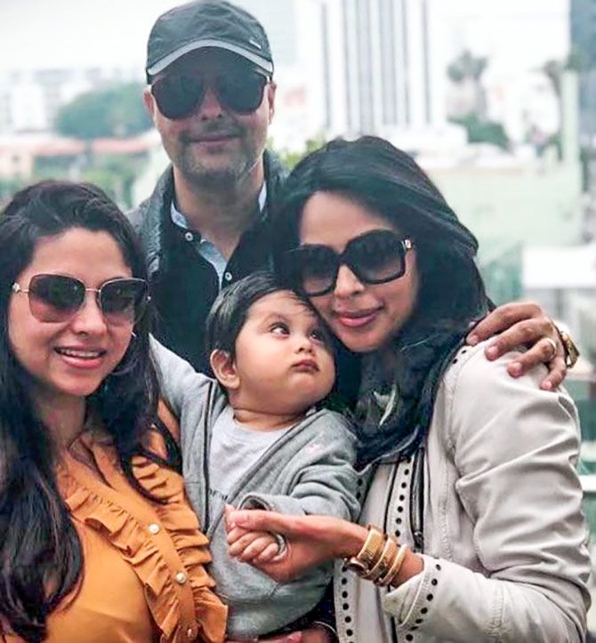 Mallika with her adorable nephew and his parents. Photograph: Kind courtesy Mallika Sherawat/Instagram