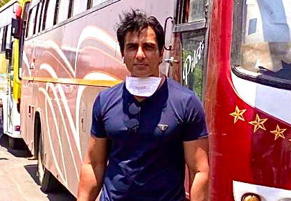 Sonu Sood with a bus he hired to send migrants home