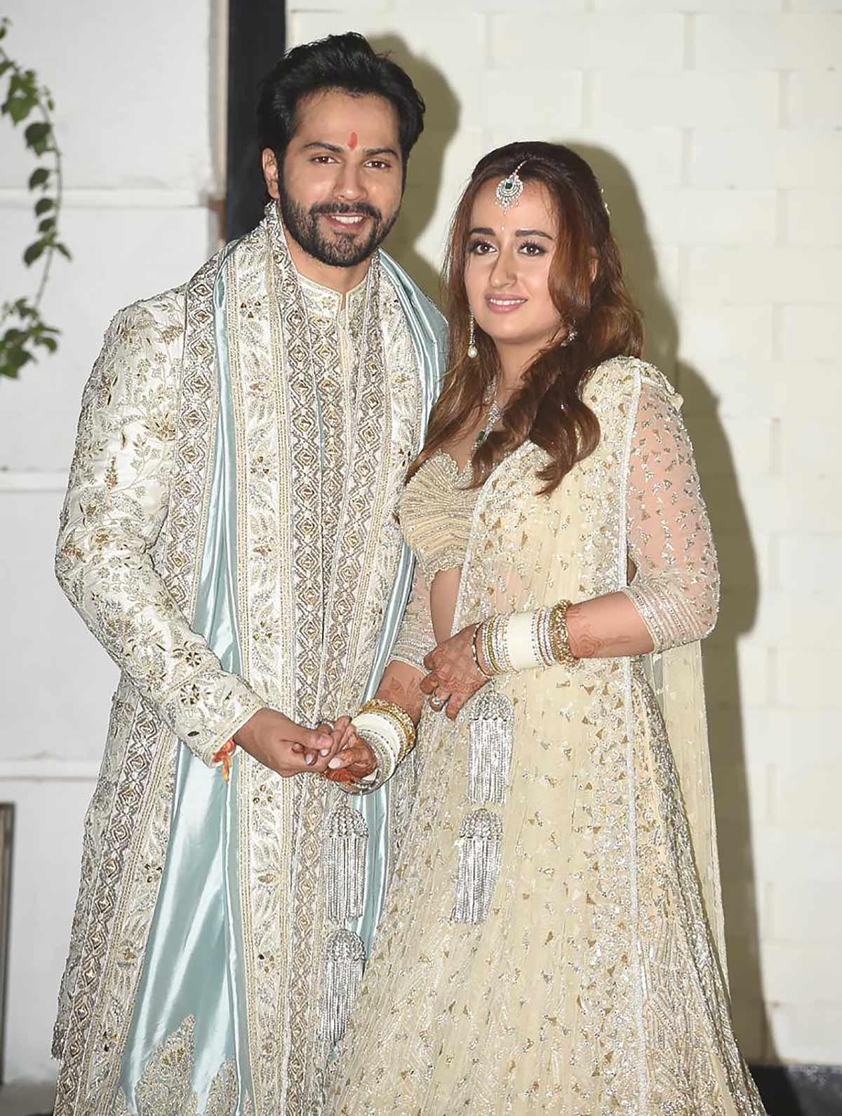 Who designed Varun's wedding look?