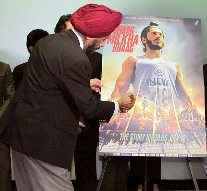 Milkha Singh signs the film's poster