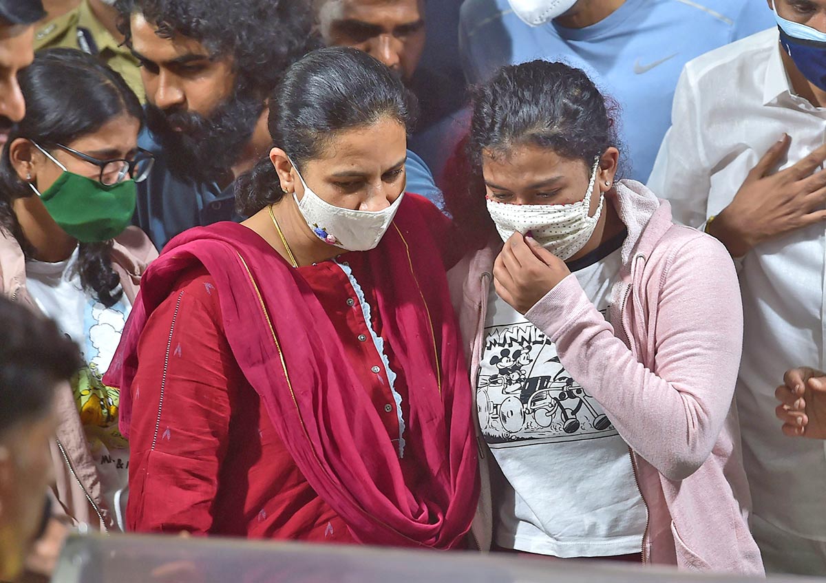 Ashwini Revanath, Puneeth Rajkumar's wife, and her daughters Vanditha and Dhrithi, bid their final farewells to a beloved husband and father. Photograph: Shailendra Bhojak/PTI