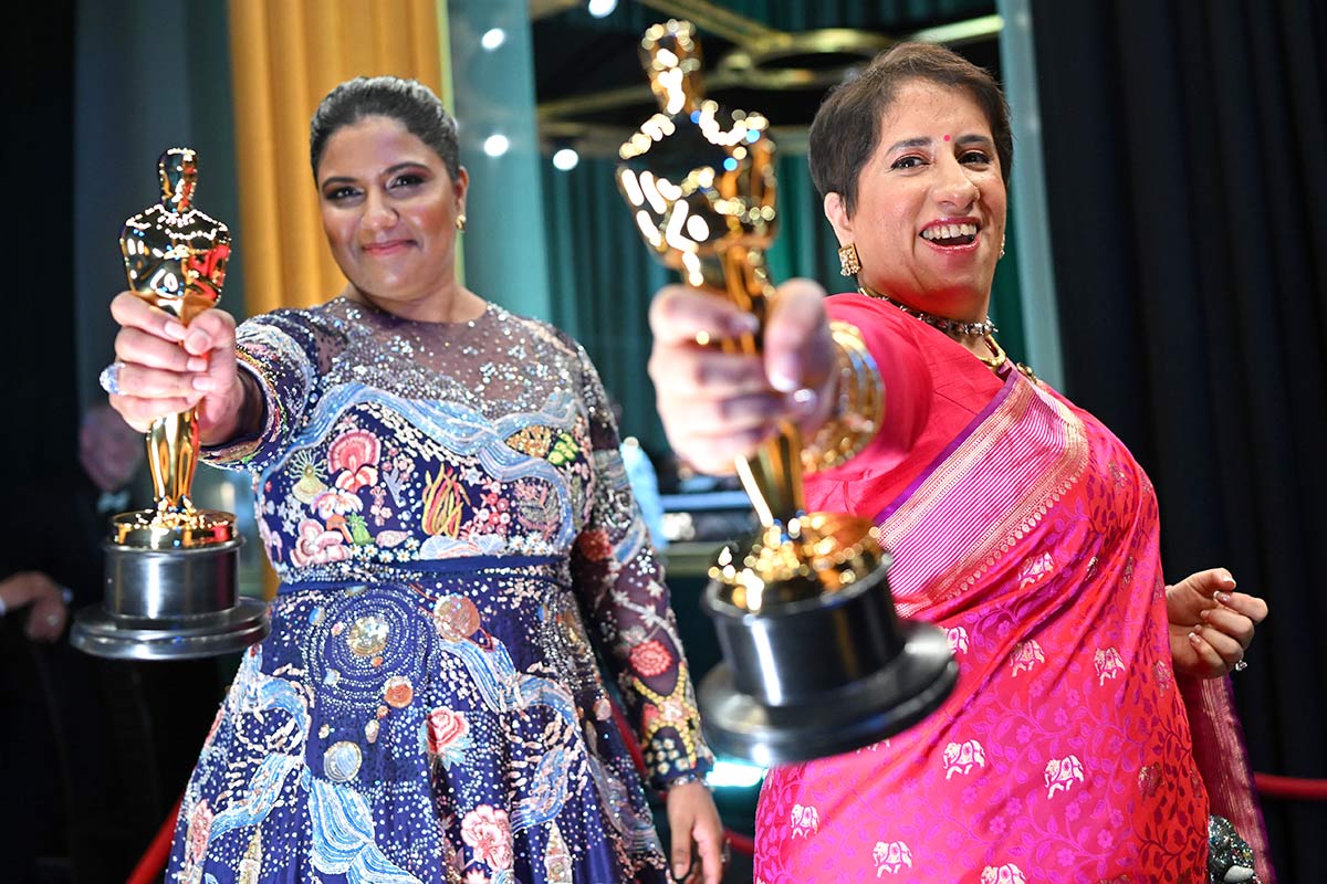 Kartiki Gonsalves and Guneet Monga at the Oscars