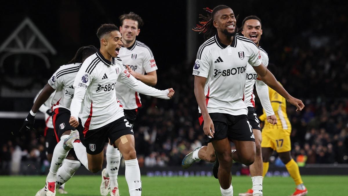 Alex Iwobi celebrates scoring Fulham's third goal against Brighton & Hove Albion at Craven Cottage, London.