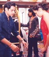 Rathore explaining the steps to a model during a fitting session. Photo: Jewella C Miranda