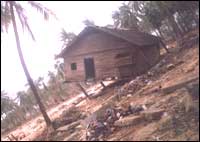 This tilted house below is the only one which survived the fury of tsunami waves in the village