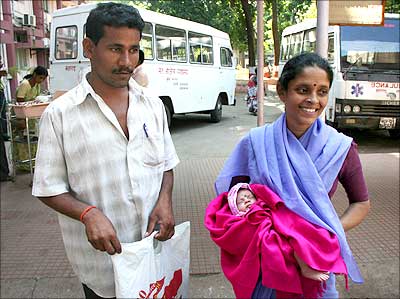 Ramu Chauhan with his wife Viju and infant Goli outside the Cama hospital