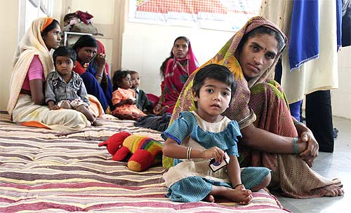 Mothers with children at the makeshift government day care centre in a yet to be inaugurated hospital at Churni in Amravati district of Maharashtra.