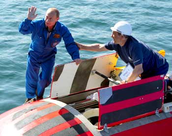 Putin waves onboard the Mir-2 mini-submersible at Lake Baikal