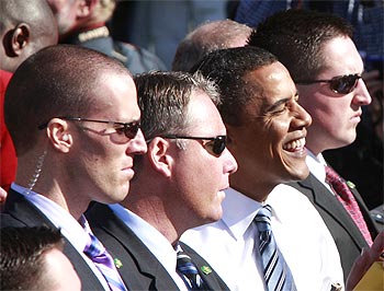 US Secret Service agents escort Obama as he greets supporters