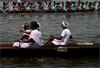 People watch the Nehru trophy race from their boat