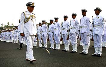 Admiral Sureesh Mehta reviews a ceremonial parade at the Southern Naval Command in Kochi.