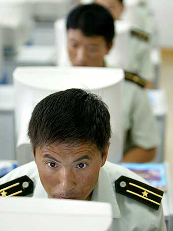 Chinese troops learn to use computers at a military base in Tianjin.