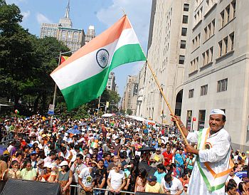 A man waves the tricolour during the parade
