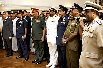 Gotabaya Rajapaksa, left with General Sarath Fonseka, 3rd left, Admiral Wasant Karannagoda, 4th left