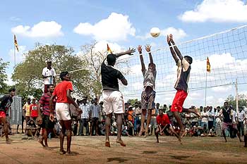 Displaced Tamils play volleyball at the Kadiragarmarpura camp in northern Sri Lanka.