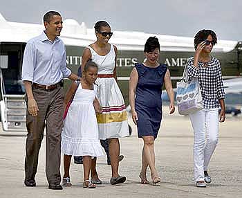 US President Barack Obama, first lady Michelle Obama and their daughters Malia (Extreme Right) and Sasha on their way to Martha's Vineyard in Massachusetts for a week-long vacation