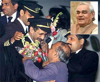 Rescued crew members of IC-814 are greeted with bouquets by colleagues at New Delhi Airport. (Inset) Then Prime Minister Atal Bihari Vajapyee