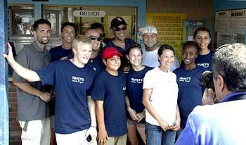 Obama (Centre, rear) poses with workers at Nancy's restaurant