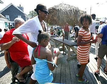 US first lady Michelle Obama (Left) with her daughters Malia (Right) and Sasha during lunch at Nancy's restaurant