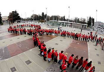 UN employees form a ribbon during a World AIDS day event