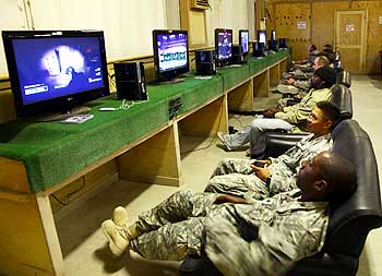 US troops play video games at a recreation room at Kandahar airfield in Afghanistan