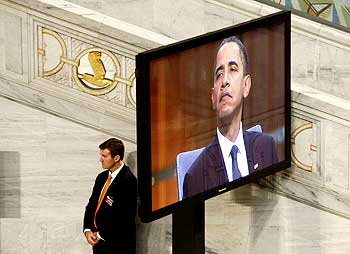 A Secret Service personnel listens to Obama's speech