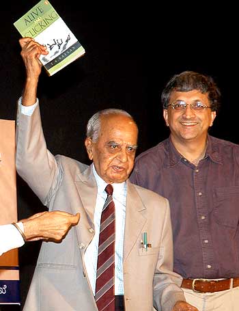 Veteran photojournalist T S Satyan during the launch of his book 'Alive and Clicking' with Ramachandra Guha
