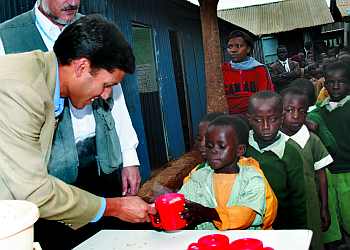 Shah at an aid distribution camp