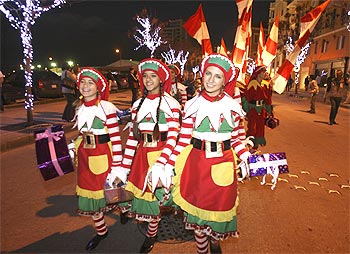 Dancers take part in a Christmas parade in downtown Beirut