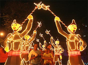 People view illuminated Christmas decorations in Cali, Columbia