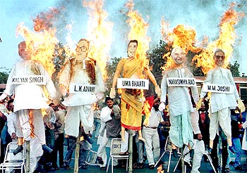 Protestors burn the effigies of BJP leaders, indicted by the Liberhan Commission Report, in Kolkata