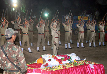 Police offer gun salute during the funeral ceremony