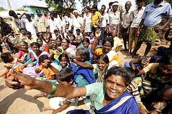 Flood-affected people protest against the lack of supplies at Bannur village near Hyderabad