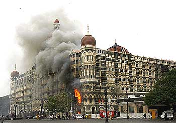 The Taj Mahal hotel is engulfed in smoke during the 26/11 attacks in Mumbai