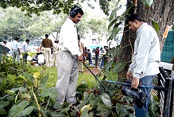 An officer surveying the blast site in Bengaluru in 2008