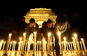 People light candles at a vigil to commemorate the Mumbai attacks in 2008