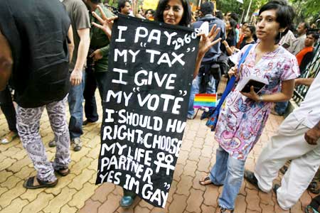 A woman holds a sign during a parade for gays and lesbian rights